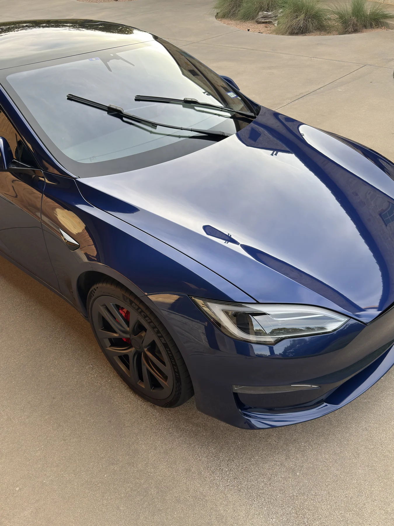 Blue Tesla photographed from above at a JX Auto Lab detail