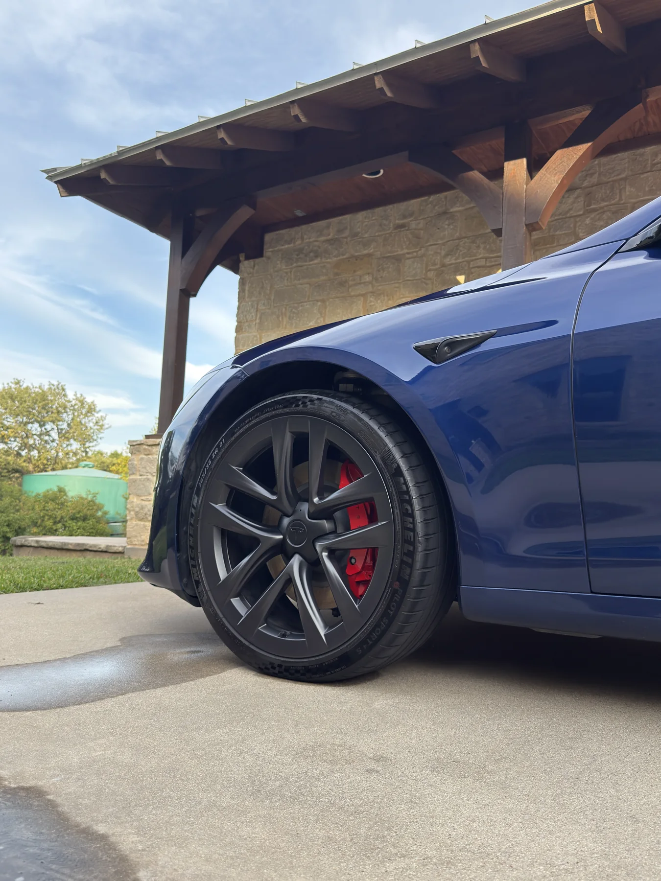 Blue Tesla front wheel and fender