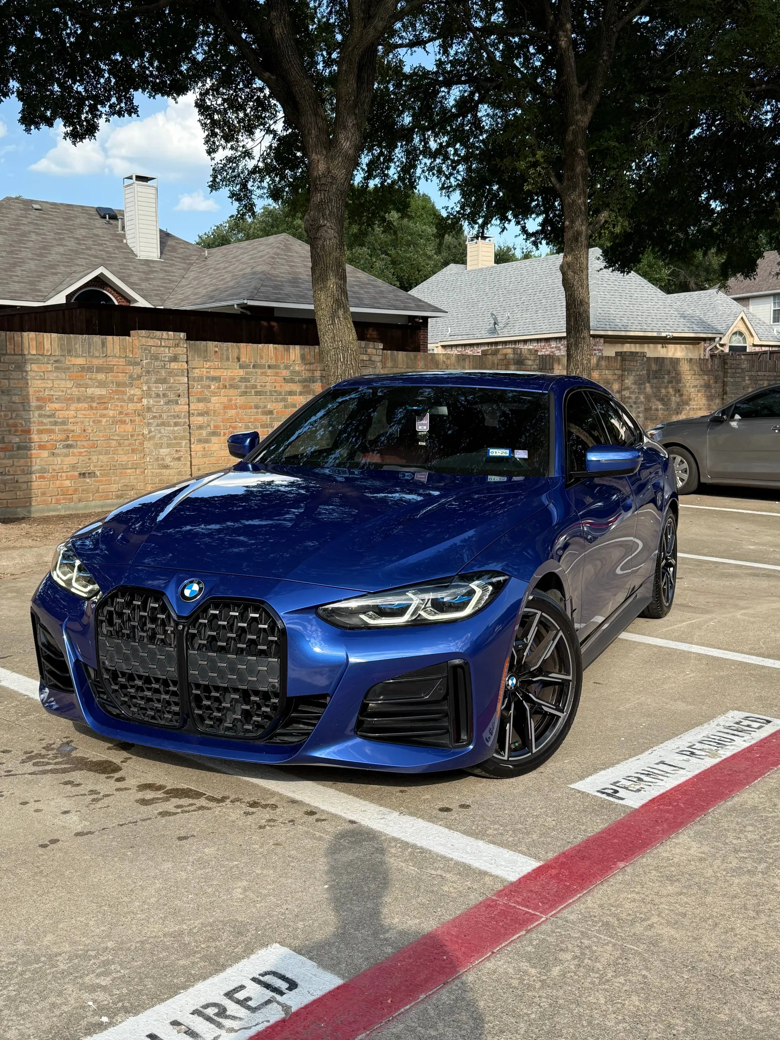 Blue BMW after a full exterior hand wash and gloss enhancement in Frisco, TX